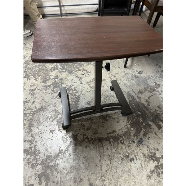 Adjustable table on wheels