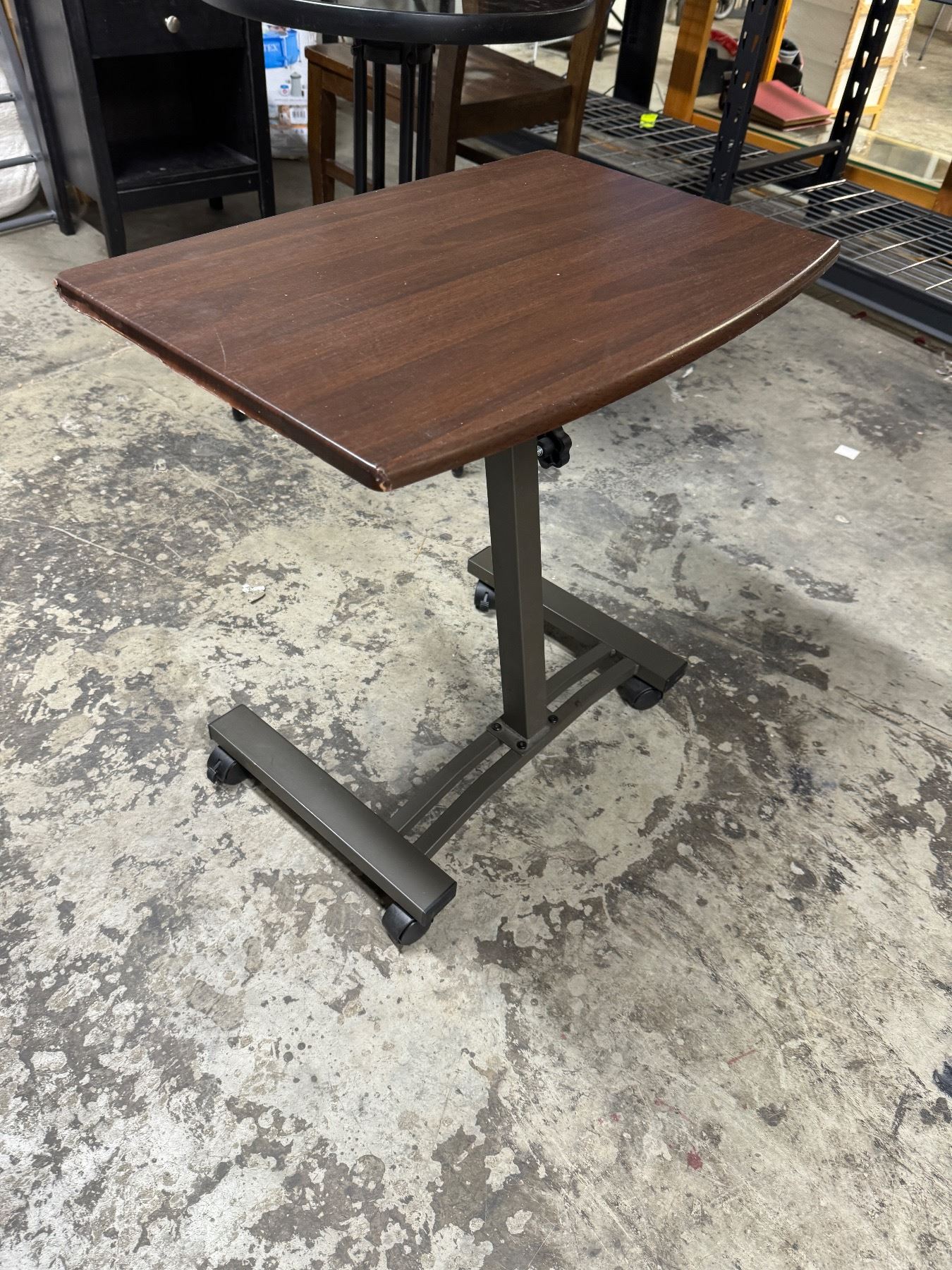 Adjustable table on wheels