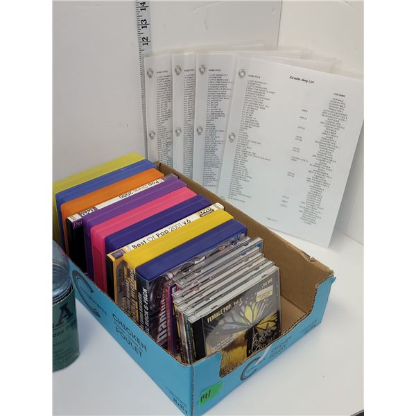 Flat of DVD Karoke DVDs With Printed Play List Song Choice