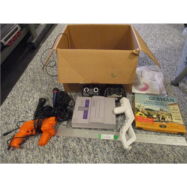 Super Nintendo Consol (May Be Missing Cords) w/Misc. Cords, Misc. Remotes, Guns etc.