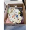 Image 2 : TWO BOXES OF SEWING PATTERNS AND MATERIAL WITH WALKER AND CART