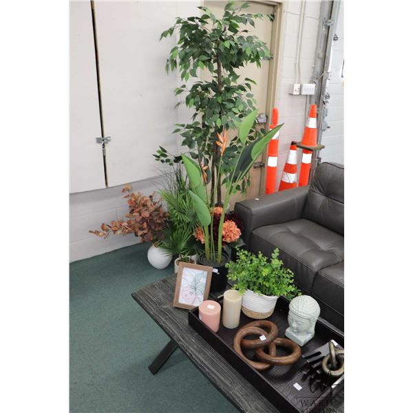 Selection of showhome decor including faux plants, leather wrapped tray, candles, glazed ceramic bud