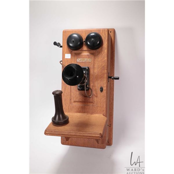 Northern Electric oak cased wall phone, internal including two dry cell batteries, note: ear piece i