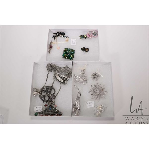 Three trays of jewellery including silver tone brooch, mother-of-pearl Marlin fish earrings etc. plu