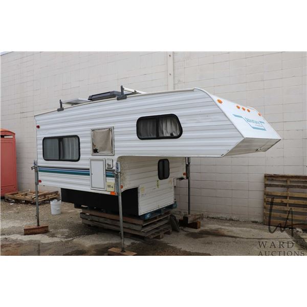 1999 Slumber Queen 80W Adventurer EXT Camper. 8' base with 6'-9" overhang, overall length of 14'-9".