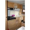 Image 21 : 1999 Slumber Queen 80W Adventurer EXT Camper. 8' base with 6'-9" overhang, overall length of 14'-9".