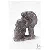 Image 2 : Inuit soapstone carving of a fisherman with his seal, signed by artist Tookar, 8" in height