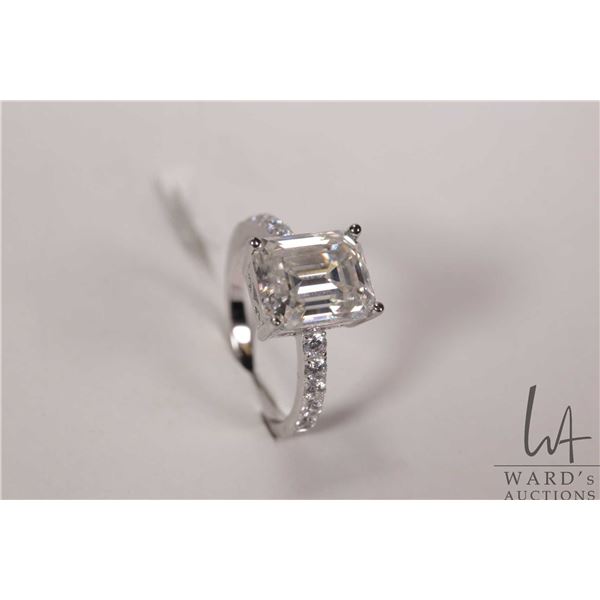 4.0ct emerald cut Moissanite ring set in sterling silver size 7 mount with white gold overlay, D VVS