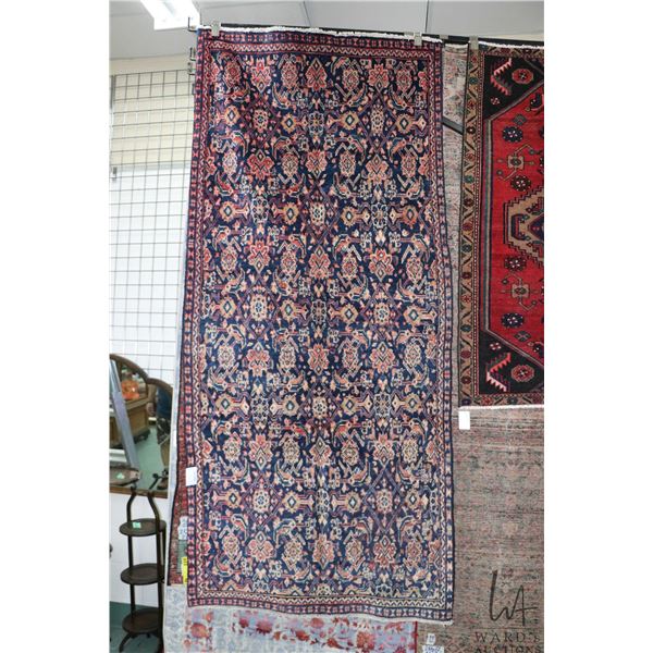 100% handmade Iranian wool carpet "Mahal" with blue background, geometric pattern and highlights of 