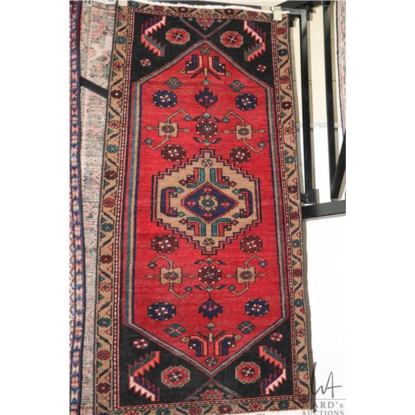 100% handmade Iranian wool carpet "Zanjan" with center medallion, red background and highlights of b
