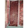 Image 1 : 100% handmade Iranian wool carpet "Hamdan" with red background, center medallion and geometric patte