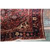 Image 2 : 100% handmade Iranian wool carpet "Hamdan" with red background, center medallion and geometric patte