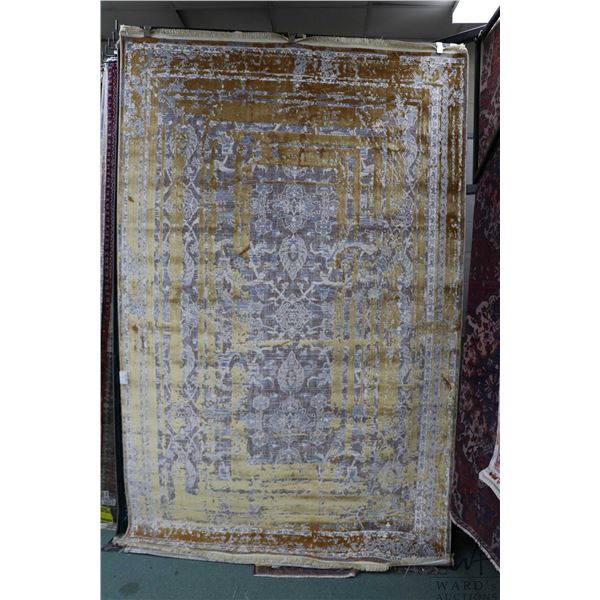New Premium Collection Sizan blended carpet with mottled gold pattern with blue, cream and taupe low