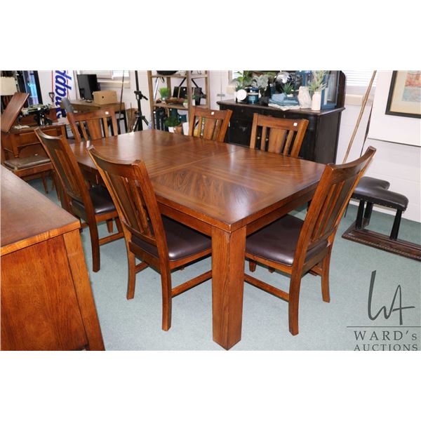 Modern mission style dining table, 60" L X 42" W, includes 18" skirted leaf and six matching side ch