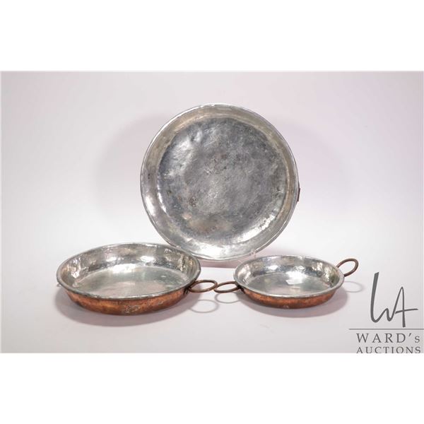 Three antique copper and tinned lined dishes including 11 1/2", 9 1/2" and 7 1/2" each with double r
