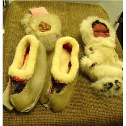 Lot of: wood mask with fur trim, fur slippers and doll with fur parka and pants (159)