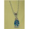 Image 1 : Tanzanite and diamond pendant and chain, 14K white gold, tanzanite oval, faceted, approx. .33 carats
