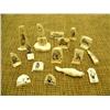 Image 1 : Lot of 16 ivory pieces with scrimshawed faces, Eskimo, seals, etc. (159)