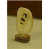 Image 2 : 2" ivory piece with Eskimo scrimshawed on a bone base (2)