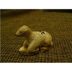 2" tall 2.5" wide bone carving of calf on fossilized ivory base - retail value $125 (2)
