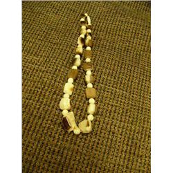 Fossilized ivory and ivory bead 7.5" necklace (2)