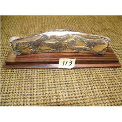 Ivory relief carving on wood base of seals with SE Alaska influence 6.5" long (2)