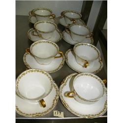 16 piece cup and saucer set with floral pattern around rims (172)