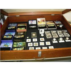 Entire case of gemstones, freshwater pearls, coins, and pocket knives (124)