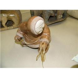 Soapstone figure with bone face and wood spear, 6" high, 5.5" wide (33)