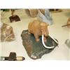 Image 1 : Soapstone mastodon with bone tusks on base 10" long, 8" high (33)