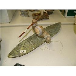 Soapstone kayaker with very well done carved face, 14" long, 4" high by E.S. (33)