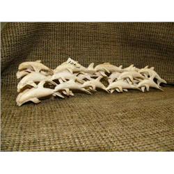 Imported school of porpoise of bone 12" long, 3" tall (33)