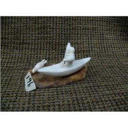 Ivory kayaker on fossilized ivory base 3.5" long, 3" tall (33)