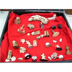 Entire case of ivory, bone, and soapstone figurines (33)
