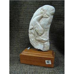 Large whales tooth mounted on wood, very intricately carved -may be imported (33)