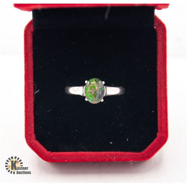 #119-7 X 9 OVAL SHAPED AMMOLITE SET IN 925 SILVER