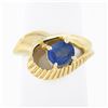 Image 1 : 14k Gold 0.80 ctw Oval Sapphire Solitaire Polished Grooved Open Loop Bypass Ring