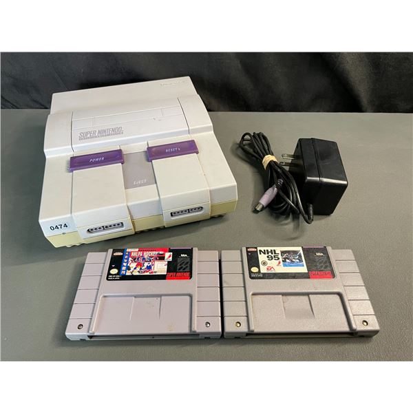 Lot of 1 Super Nintendo Entertainment System w/ Cord & Games - Used; POWERS ON/WORKS!