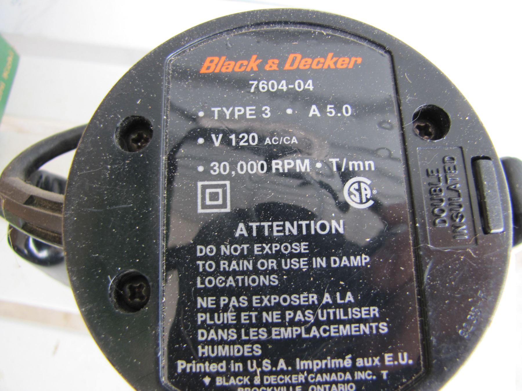 Black and Decker Router with assorted parts and pieces