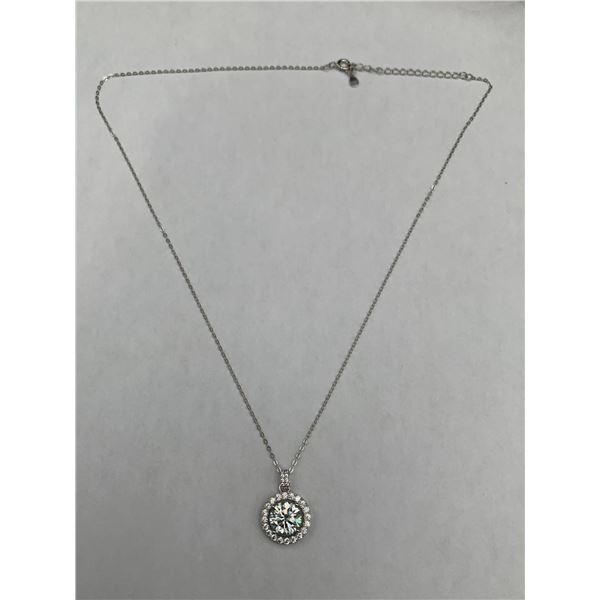 3.00 CARAT GRA CERTIFIED MOISSANITE VVS  SET IN THE CENTER SURROUNDED BY A ROUND HALO WITH A FEW MOR