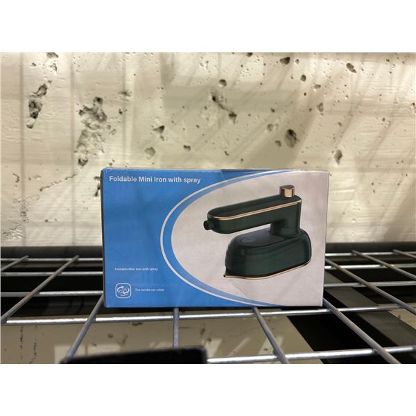 Foldable mini clothing iron with spray function