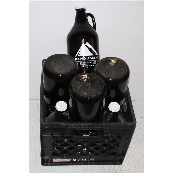 MILK CRATE FULL OF BROWN GLASS JUGS
