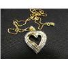 Image 1 : Diamond heart pendant and chain, 10K yellow gold, full cut diamonds, approx. 1 carat, SI1-I1 clarity