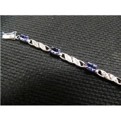 Tanzanite and diamond bracelet, 14K white gold, tanzanite, oval, faceted, approx. 3 carats, transpar