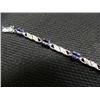 Image 1 : Tanzanite and diamond bracelet, 14K white gold, tanzanite, oval, faceted, approx. 3 carats, transpar