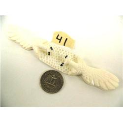 Pair of carved ivory eagles by Craig Niksik (2)