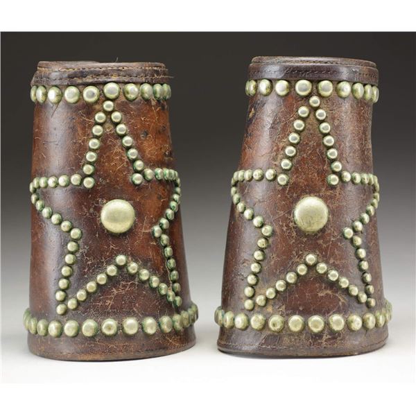PAIR OF COWBOY STUDDED LEATHER CUFFS.