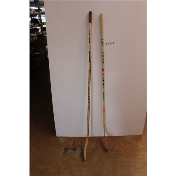 *(2) Hockey Sticks - 1 New, 1 Used