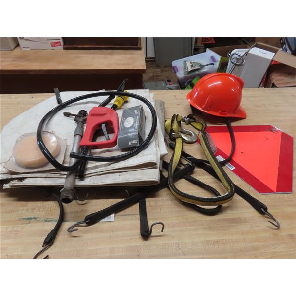 box of hoses, sprinklers, hardhat, slow moving traffic sign