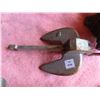 Image 3 : boat anchor, bench vise, and trailer jack
